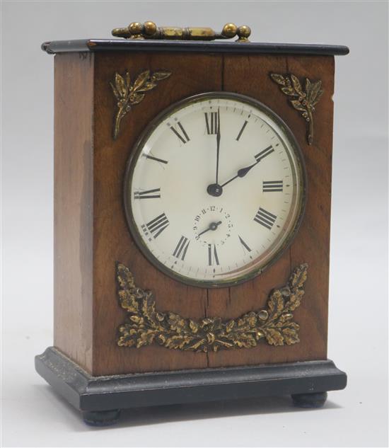 A French walnut and gilt mantel timepiece with alarm